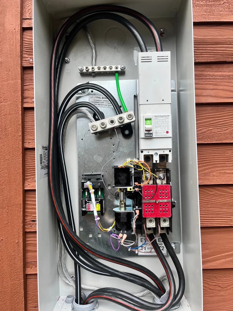 Open generator transfer switch enclosure with connected wiring